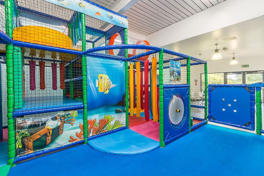 Soft play area. Brightly coloured and brightly lit