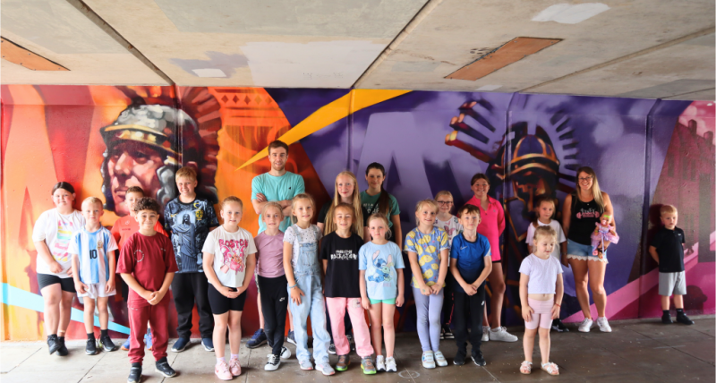 Mark Shields with some of the young people whose ideas inspired the design