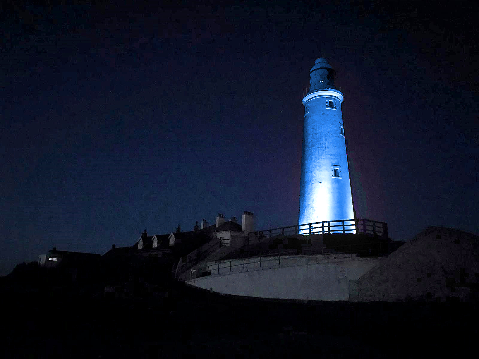 St Marys Lighthouse at night lit up in Blue
