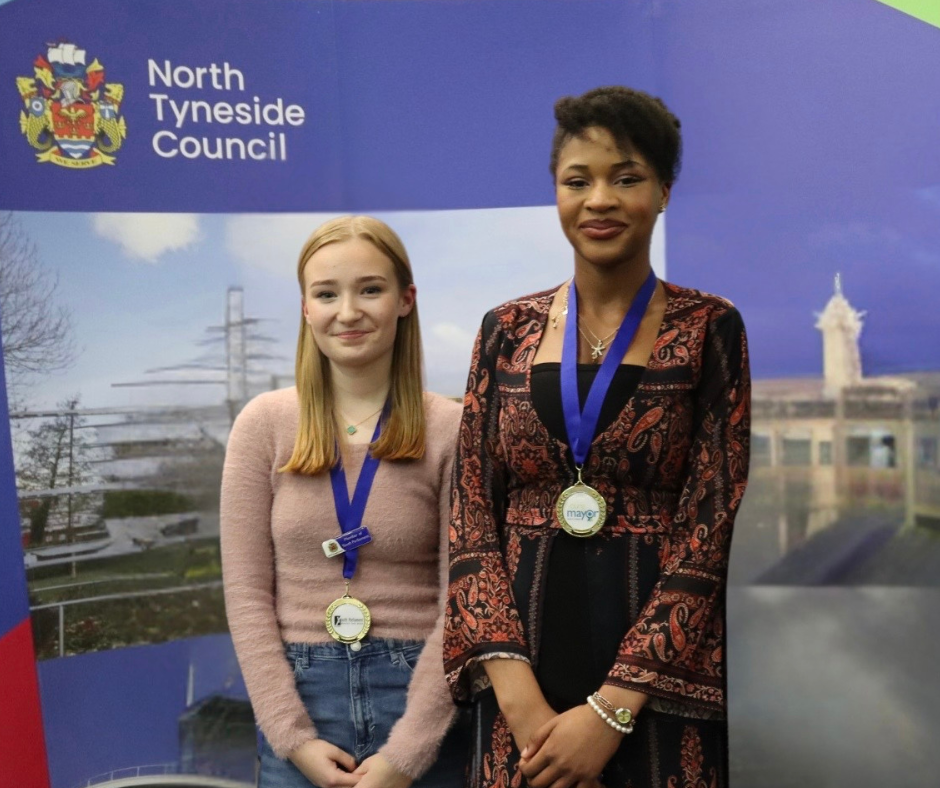 Young Mayor and Member of Youth Parliament standing side by side