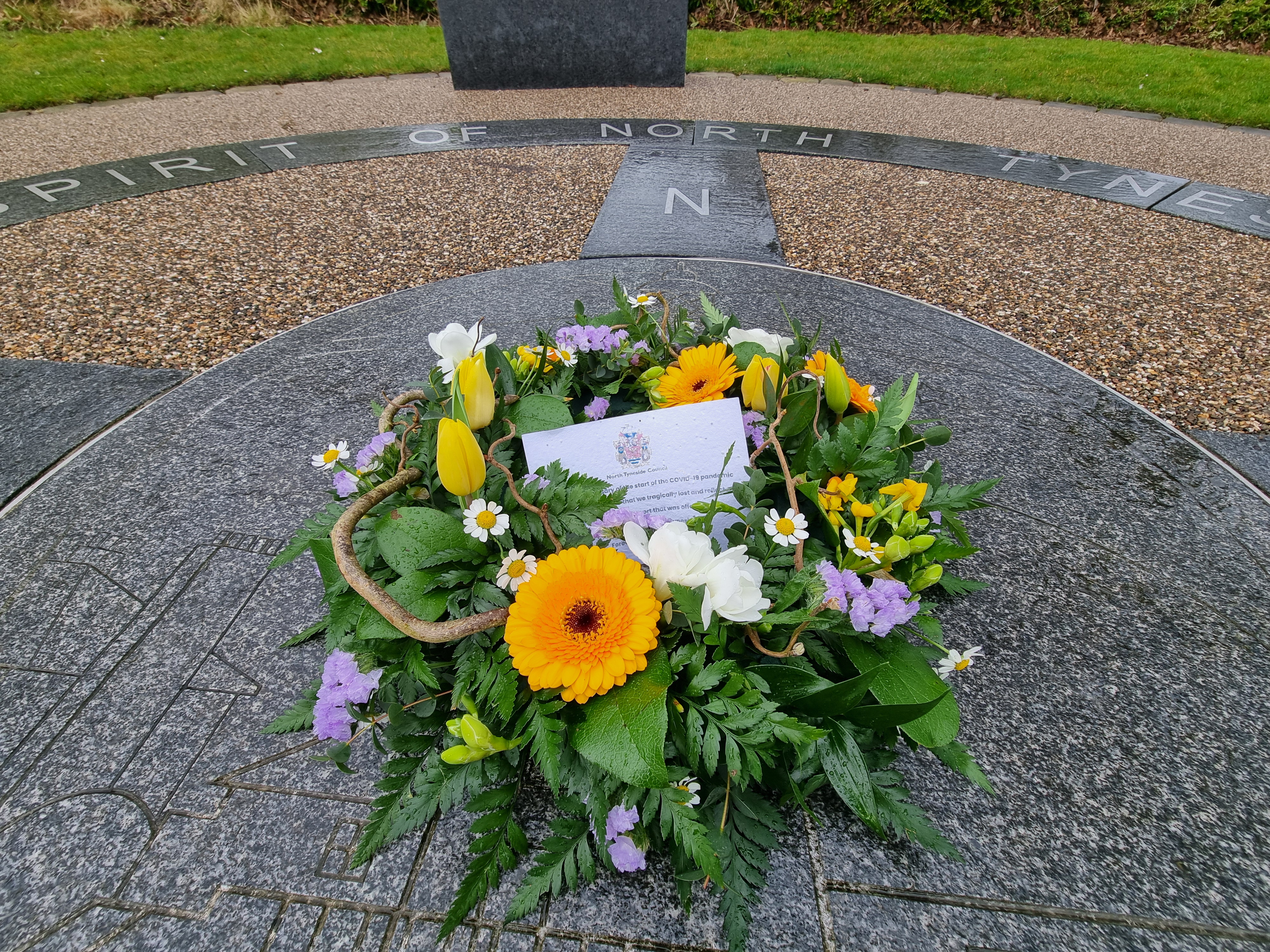 A wreath laid on the site of one of the Covid memorials