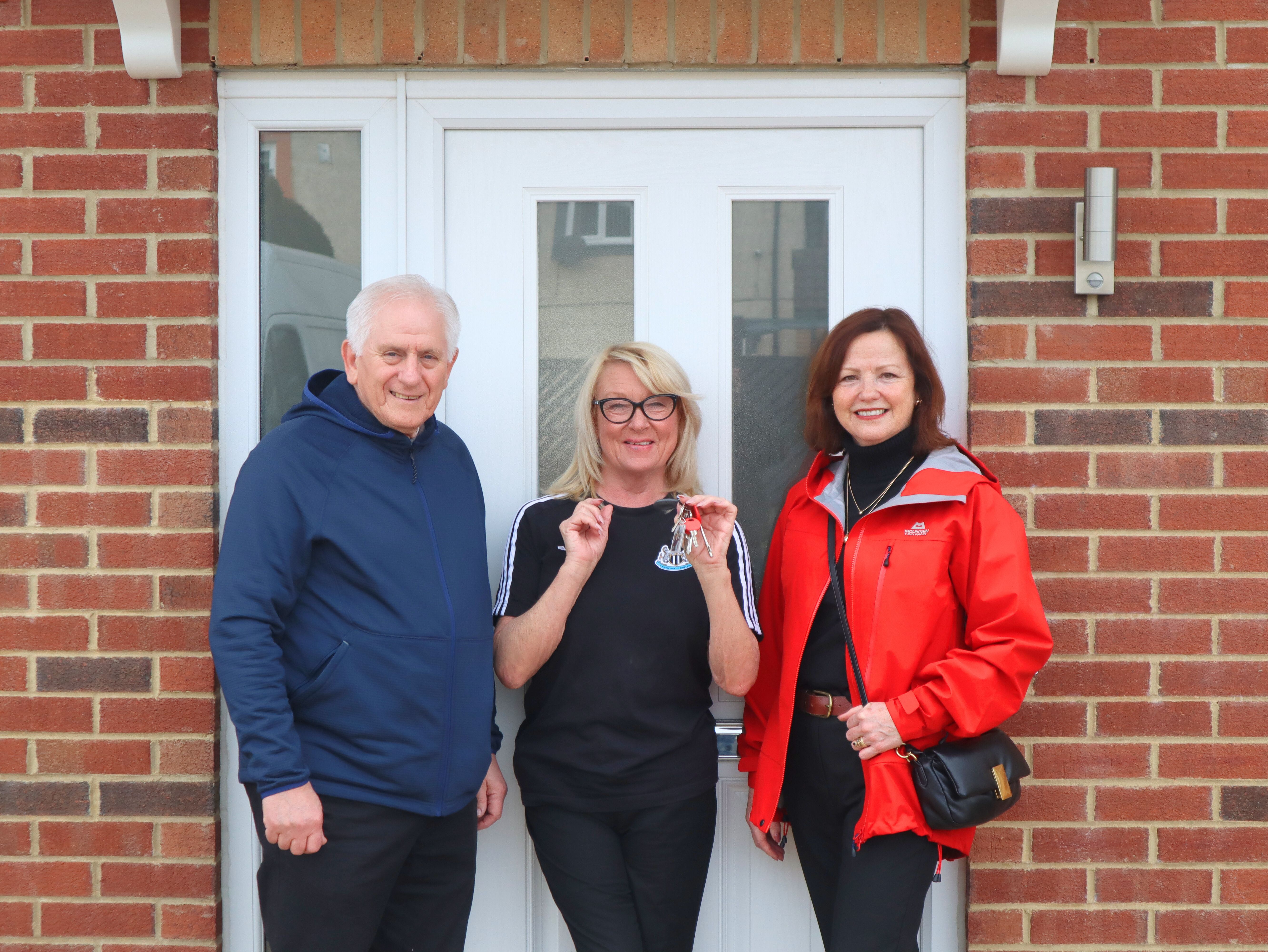 (From left to right): Cllr John Harrison, cabinet member for Housing, with one of the new residents Sharon MacDonald and North Tyneside’s Elected Mayor Karen Clark. 