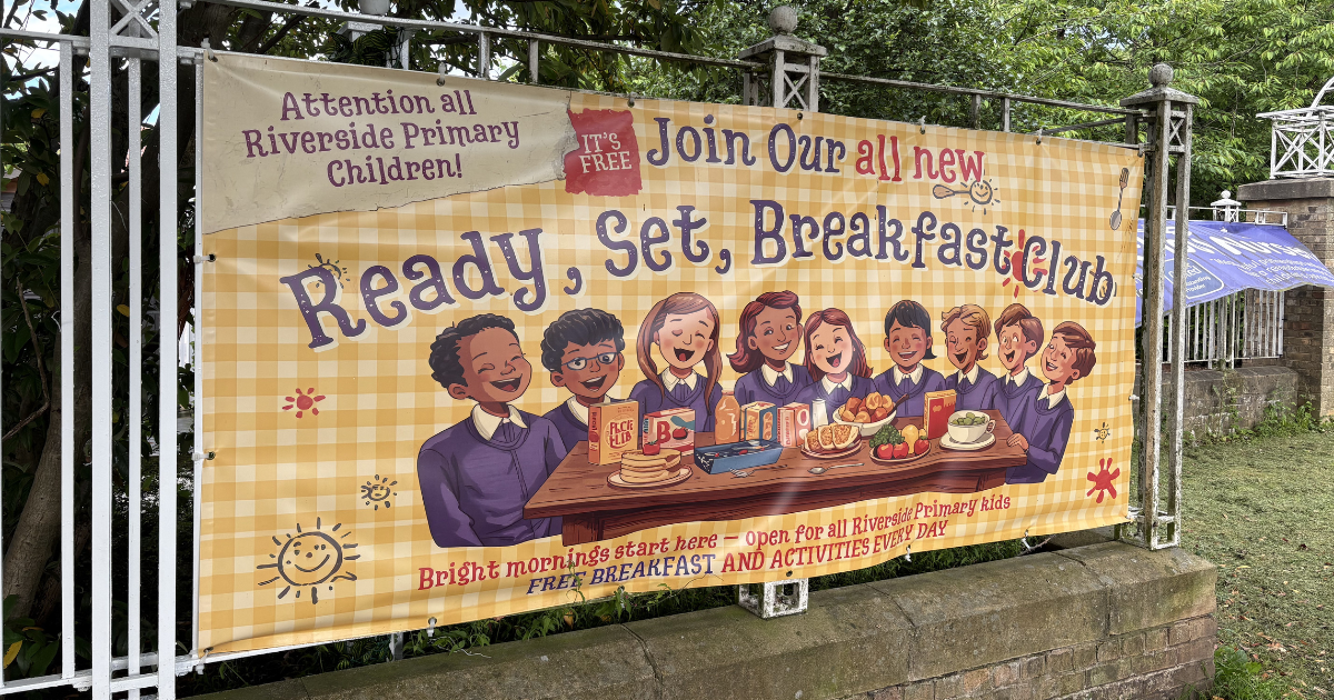 Banner pictured outside the school showing Readfy, Set, Breakfast Club logo