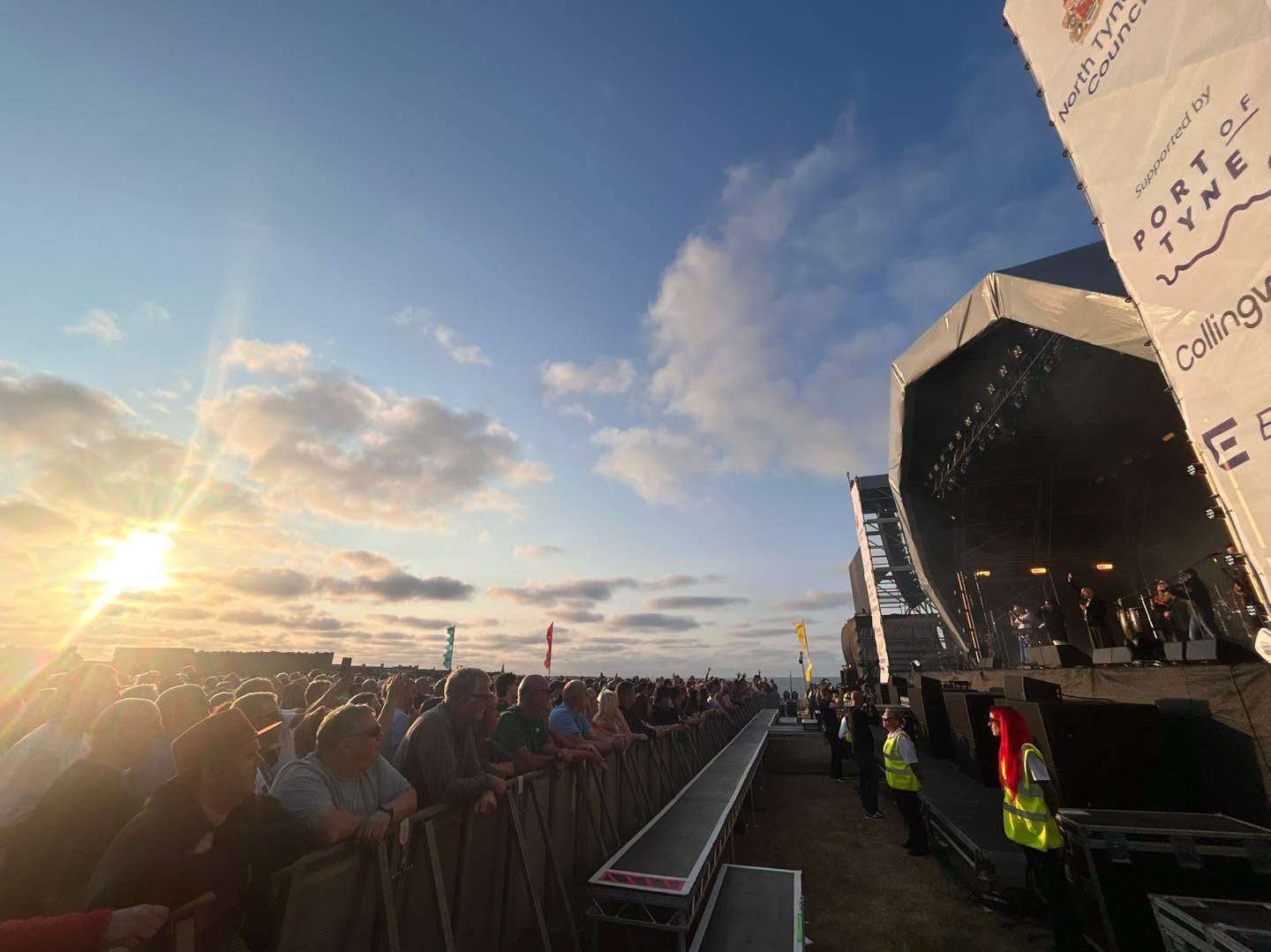 A packed crowd look on to the Performers on stage.