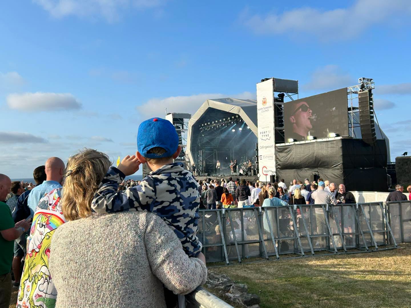 Fun for all ages- a mother and child look on to the vast stage.