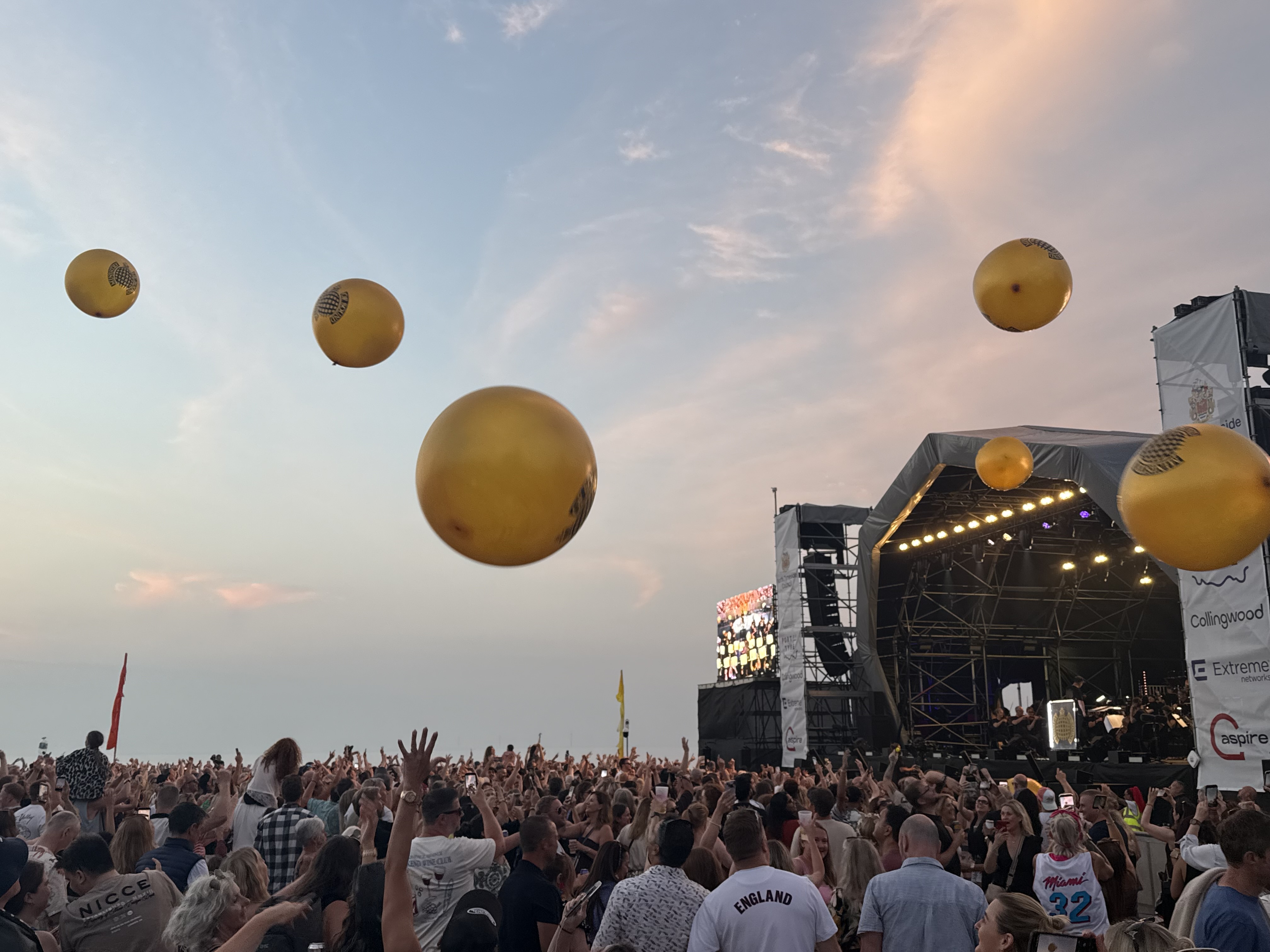 Golden, inflatable spheres bounced around the crowd
