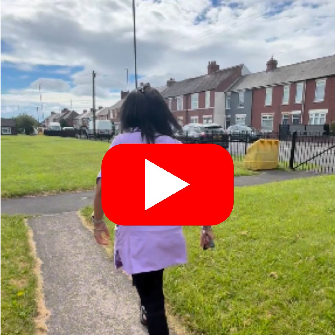 Reablement team member pictured leaving a residents home via a grass path with a red youtube play button in the centre