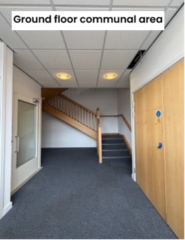 Large corridor with staircase and doors