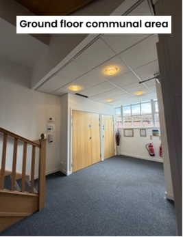 Large corridor with staircase and doors