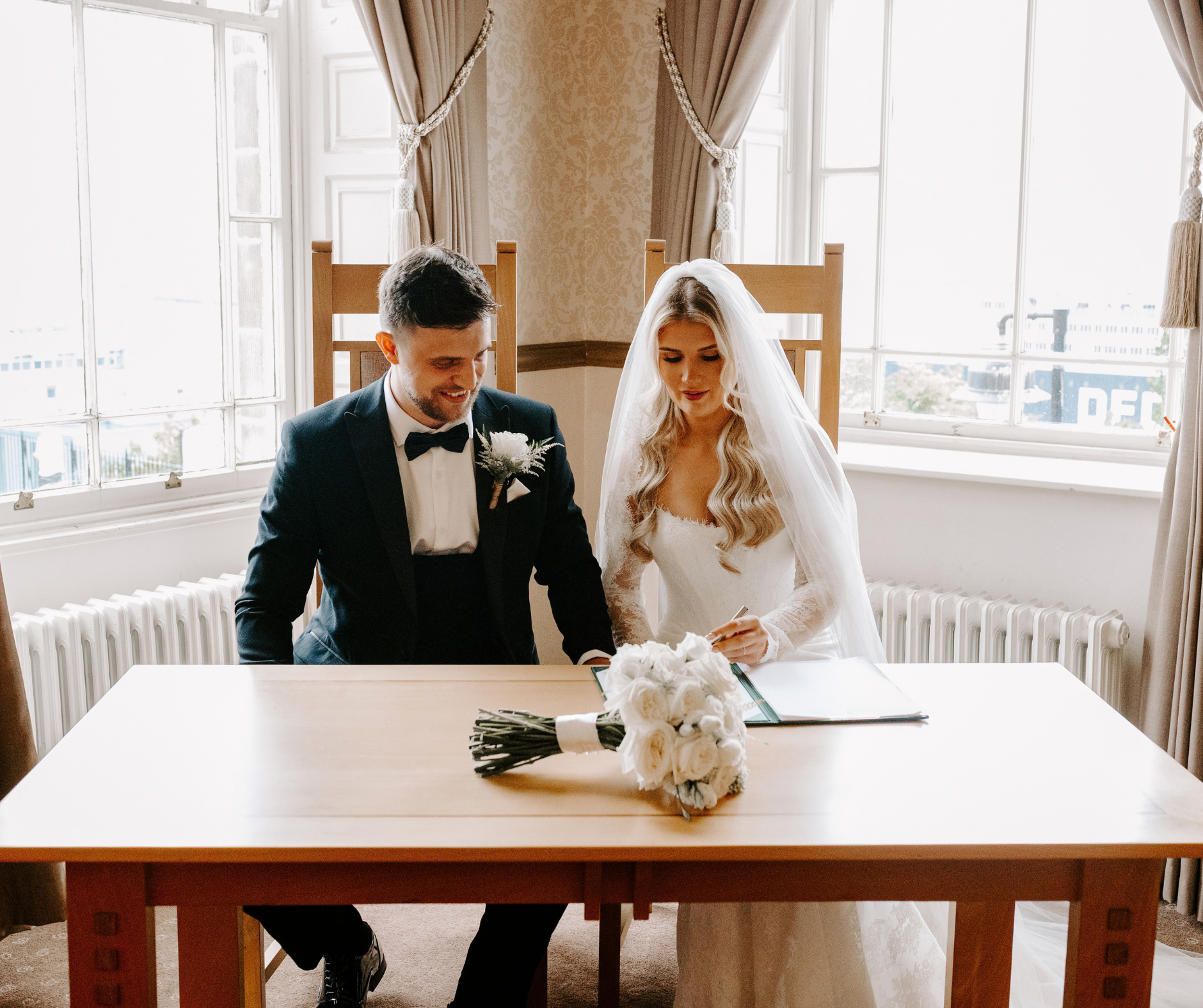 A bride and groom at a table
