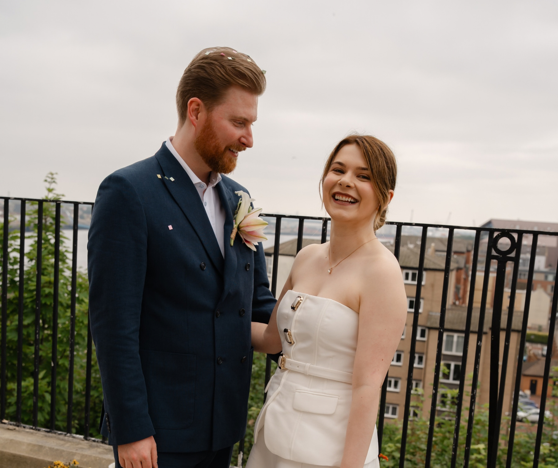 A bride and groom on the balcony at Maritime Chambers 