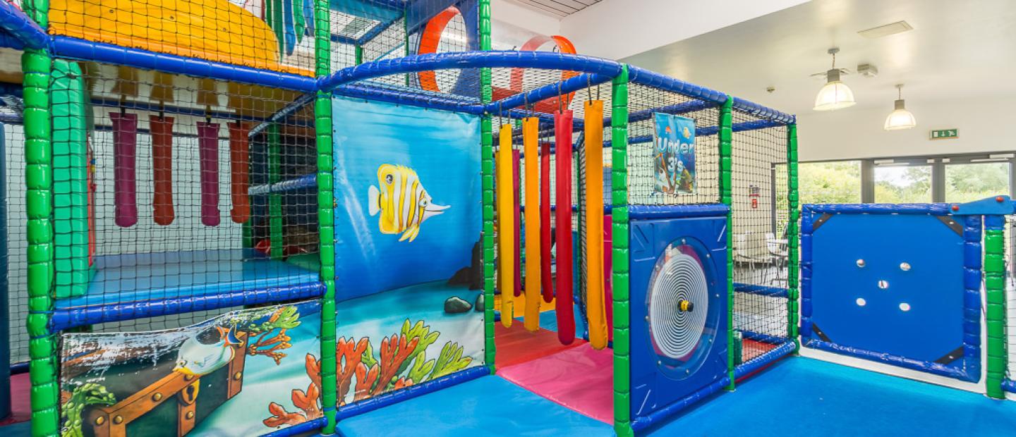 Soft play area. Brightly coloured and brightly lit