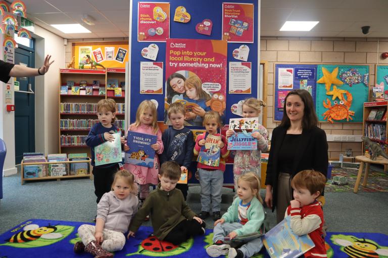 kids reading books in library