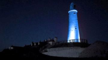 St Marys Lighthouse at night lit up in Blue