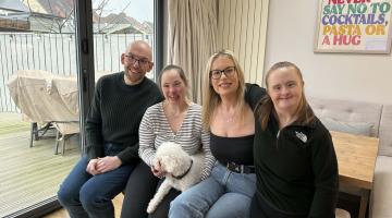Adam, Jo, Jade and Lisa pictured on a bench in their home. 