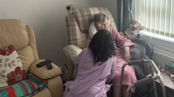Image of Reablement Carer with a resident in their home providing support