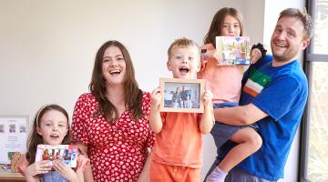 Ed and Annabel with their three children, who they adopted together as a sibling group.