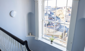 large arched window on a stairwell