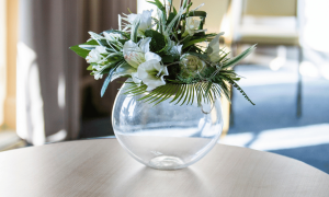 vase on a table with flowers in