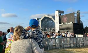 Fun for all ages- a mother and child look on to the vast stage.