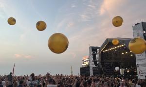 Golden, inflatable spheres bounced around the crowd