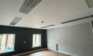 Empty room with window and wooden floor