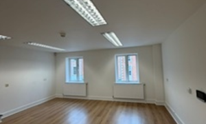 Empty room with window and wooden floor