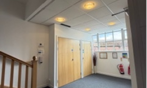 Large corridor with staircase and doors