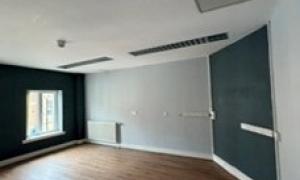 Empty room with window and wooden floor