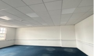 Empty room with carpet and window