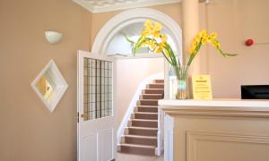 A reception room with a light coloured desk