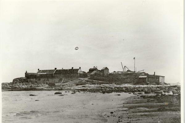 An old photograph of a lighthouse being constructed