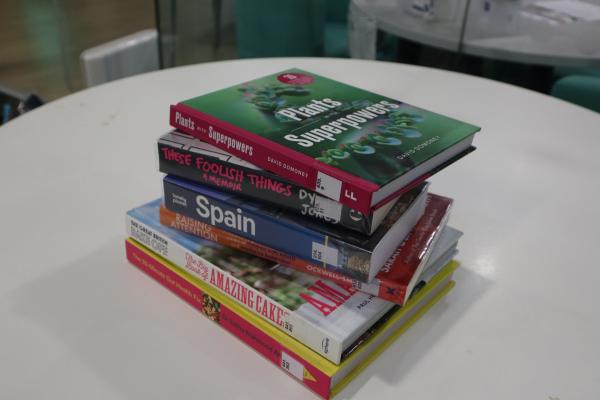 a pile of eight books