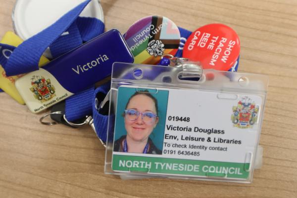 badge that a worker will wear. showing their face and name